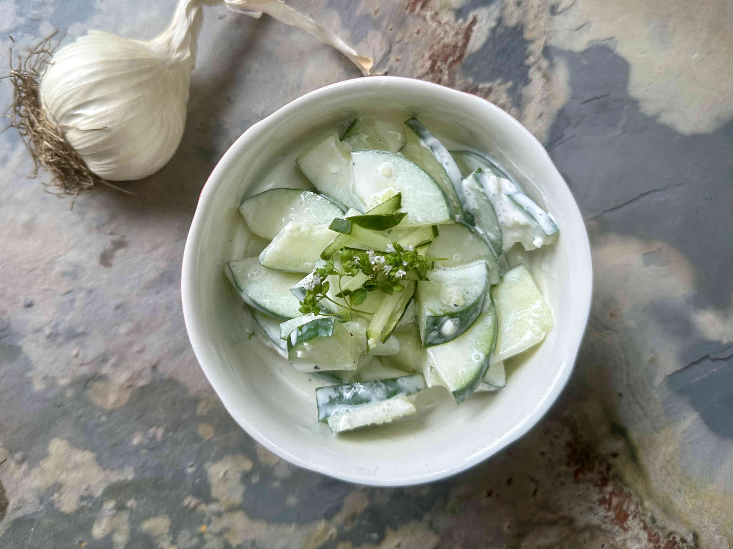 Fresh cucumber salad with sour cream